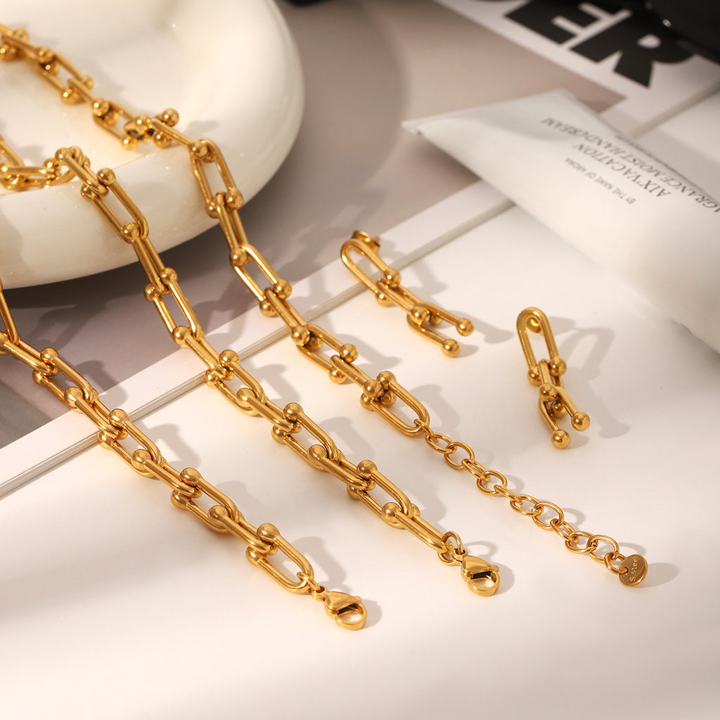 Set including necklace, horseshoe chain bracelet and earrings is made of high quality stainless steel