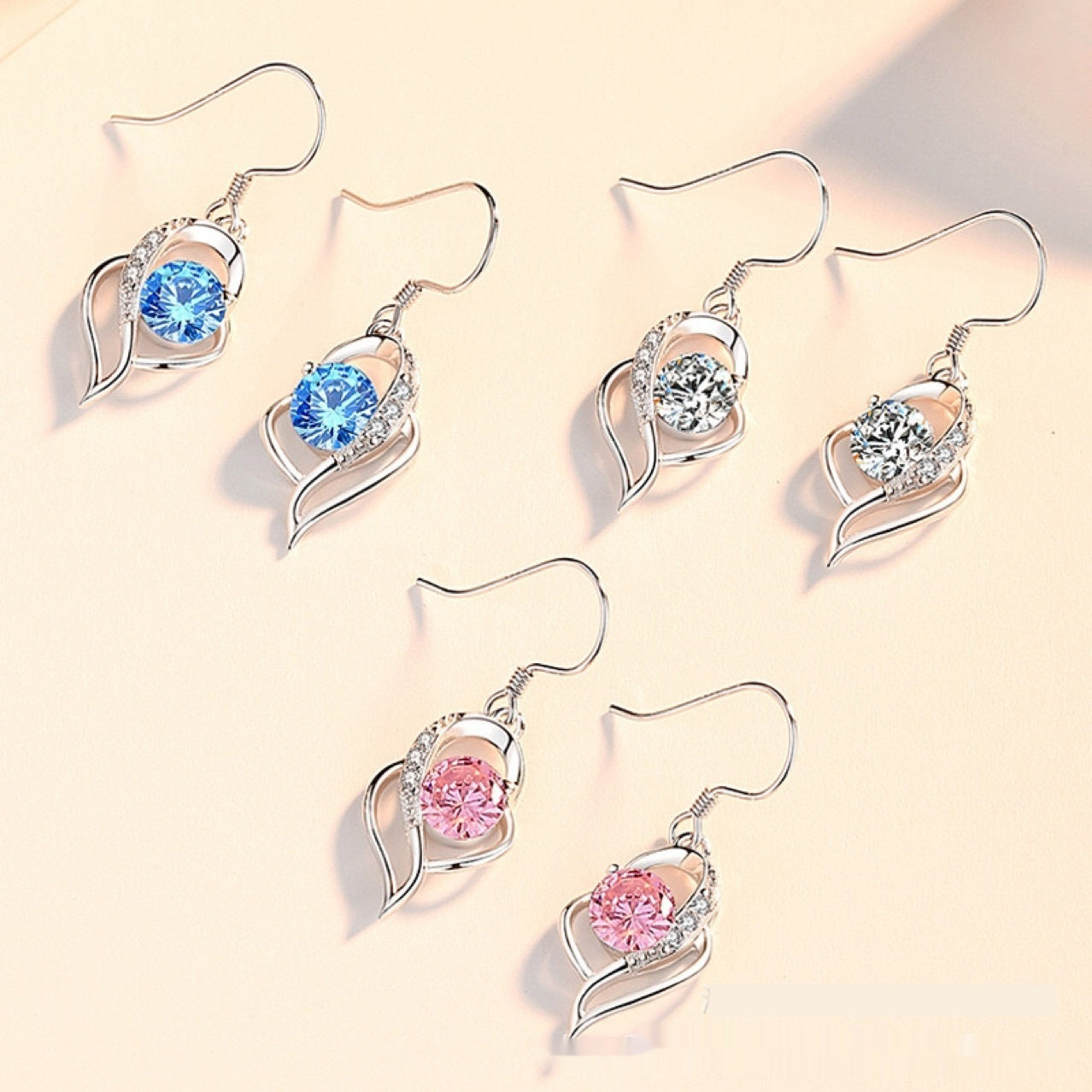 Elegant and simple heart-shaped earrings with micro-inlaid zircons
