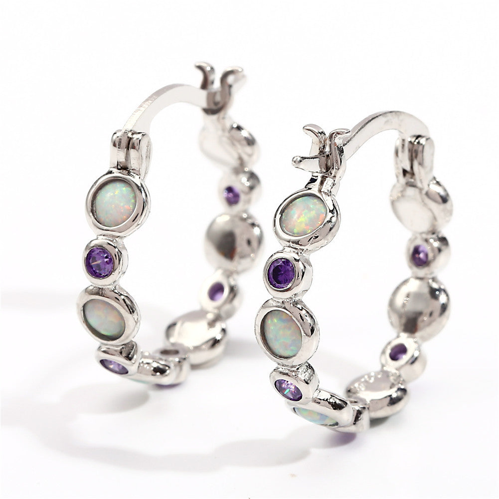 Earrings combine brilliance and delicacy, enhancing
