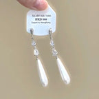 Sparkling star clip-on earrings with tassels