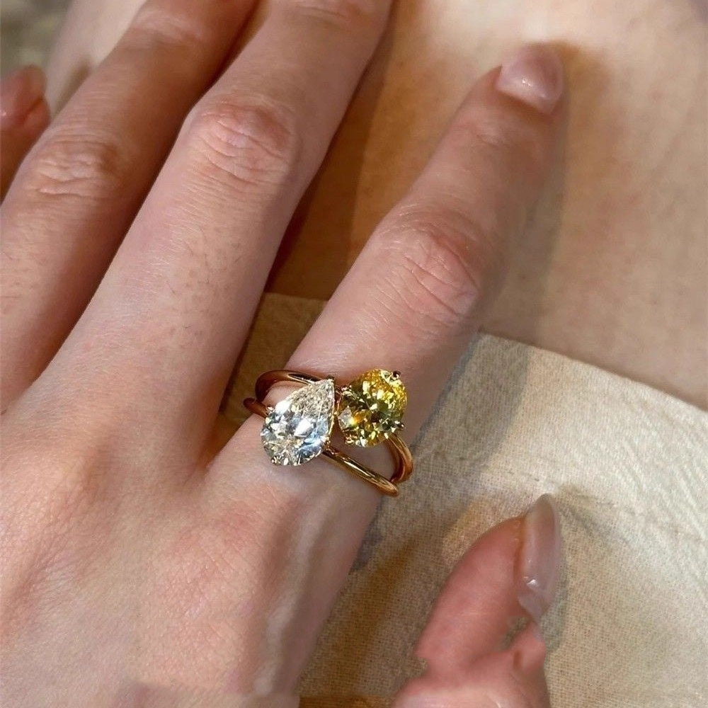 Lightweight open copper ring with contrasting teardrop zirconia