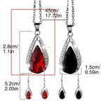 This set of a necklace and a pair of earrings features an elegant design with glass drop pendants.