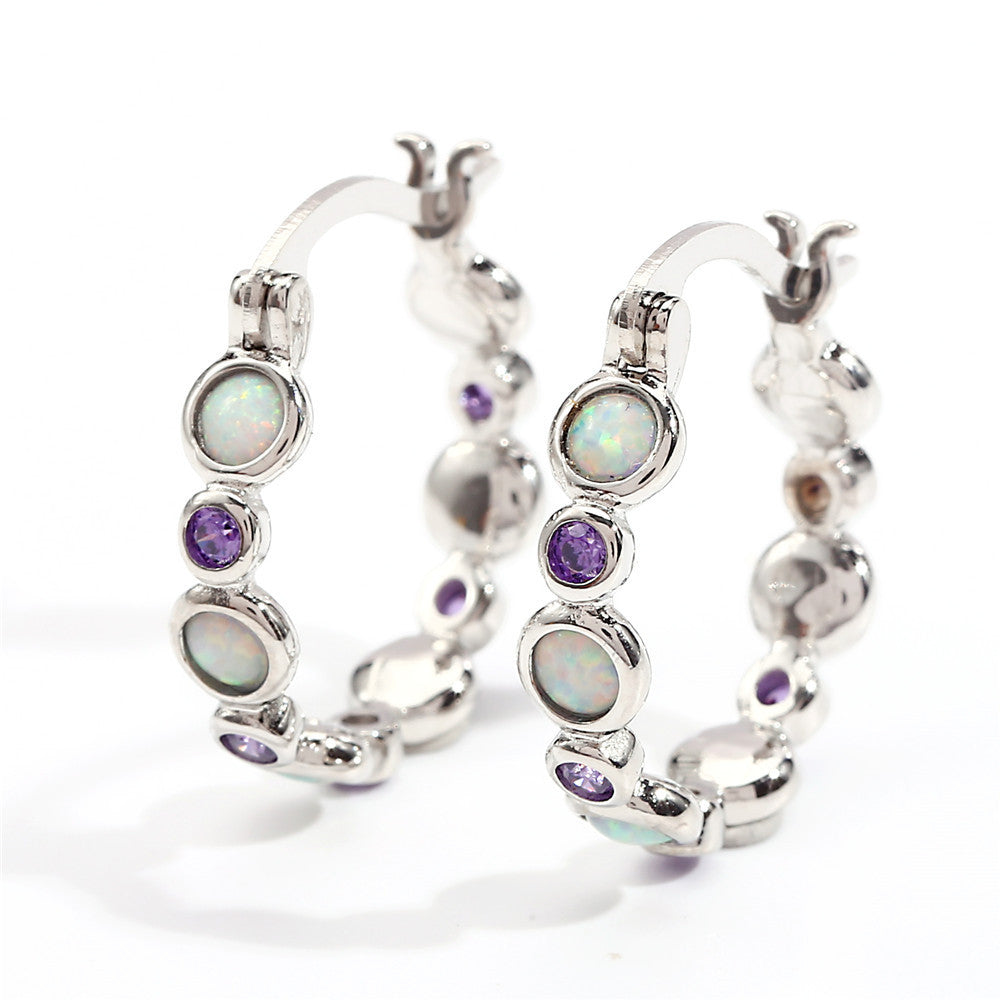 Earrings combine brilliance and delicacy, enhancing