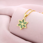 Six-pointed star shaped emerald zircon pendant necklace combines geometric design and fine craftsmanship