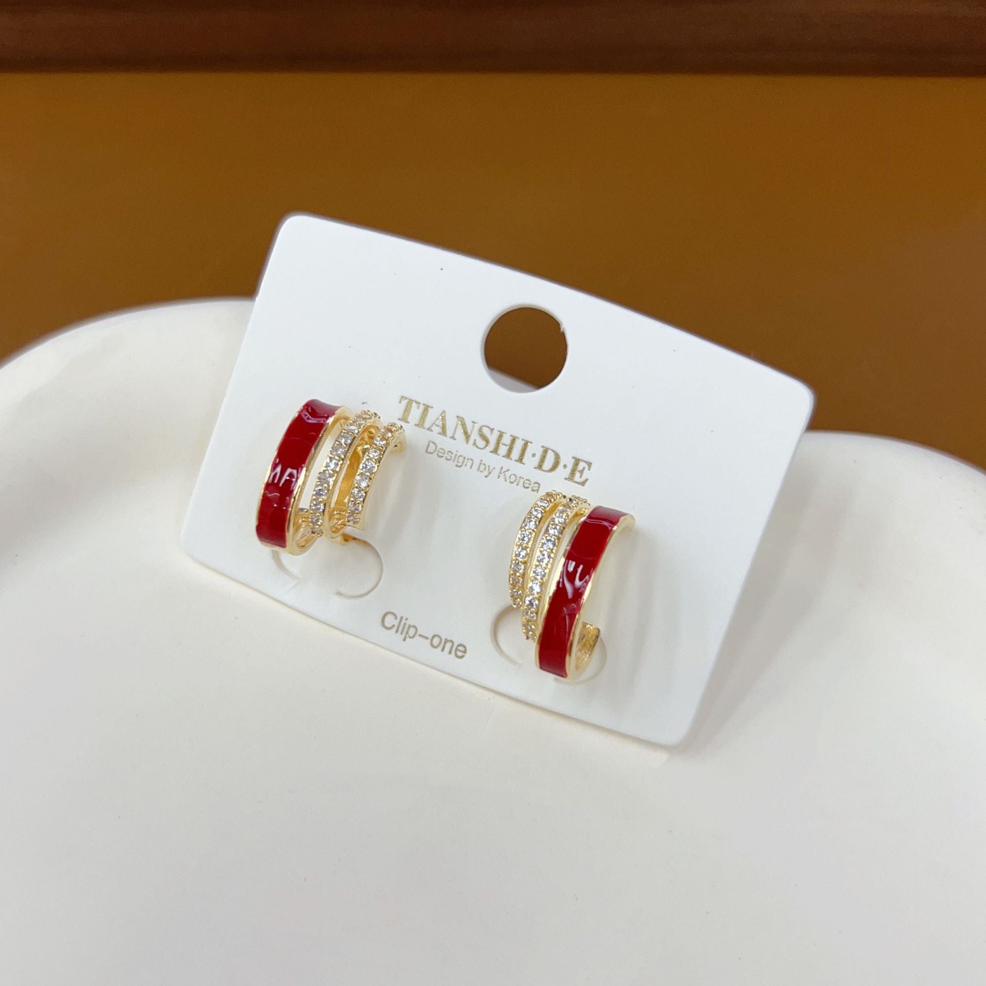 Clip-on earrings without piercing with oil painting and red diamonds