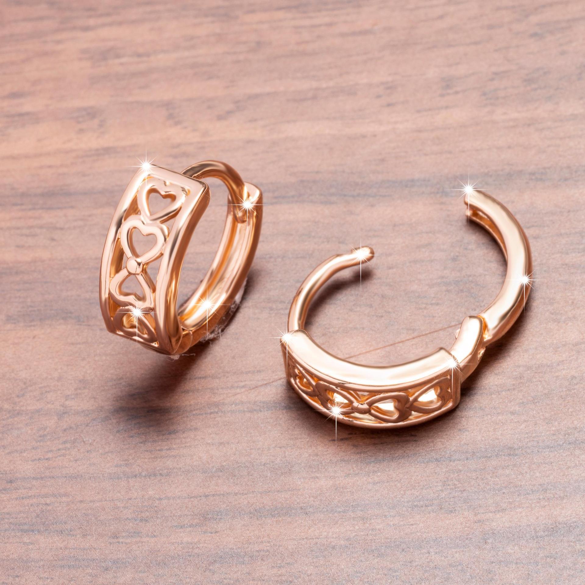 Hollow heart clip-on earrings with a shiny finish