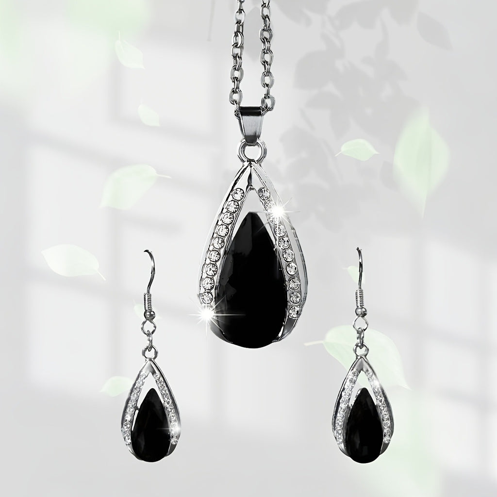 This set of a necklace and a pair of earrings features an elegant design with glass drop pendants.