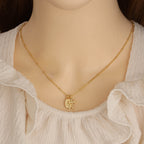 Gold Virgin Mary cross necklace