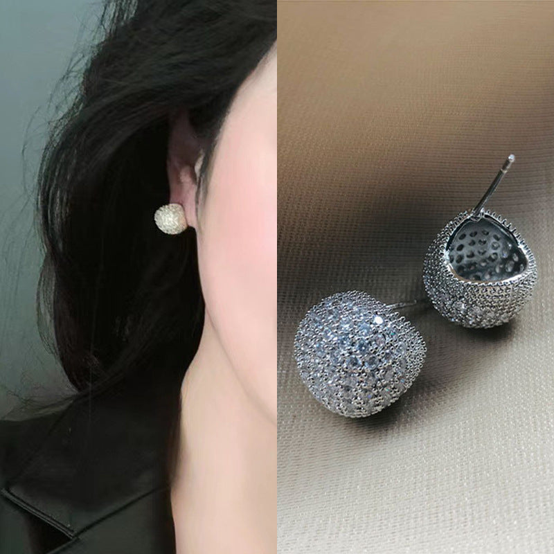 Light luxury clip-on earrings in the shape of small golden pearls adorned with diamonds