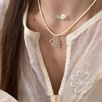 This women's necklace features a vibrant and delicate design, combining colorful yellow or blue beads with a hollow flower pendant.