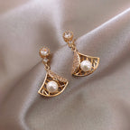 Openwork fan-shaped earrings with sterling silver needle