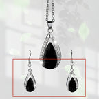 This set of a necklace and a pair of earrings features an elegant design with glass drop pendants.