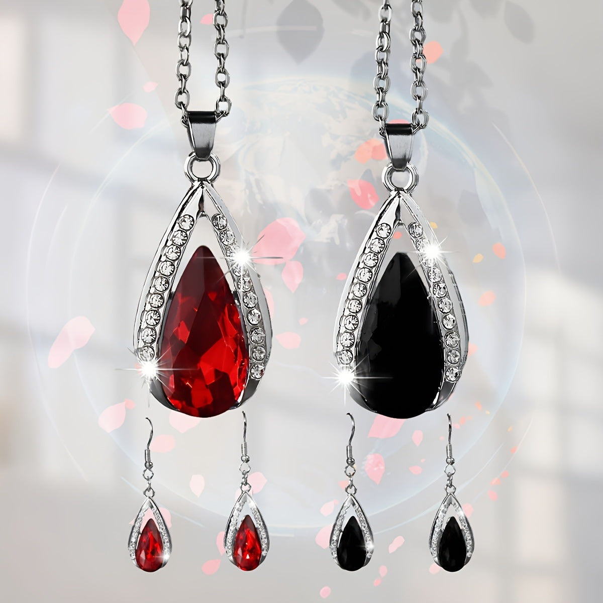 This set of a necklace and a pair of earrings features an elegant design with glass drop pendants.