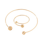 Open bangle bracelet, decorated with balls of various sizes, combines contemporary design and minimalist elegance.