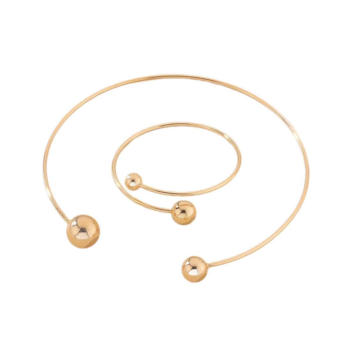 Open bangle bracelet, decorated with balls of various sizes, combines contemporary design and minimalist elegance.