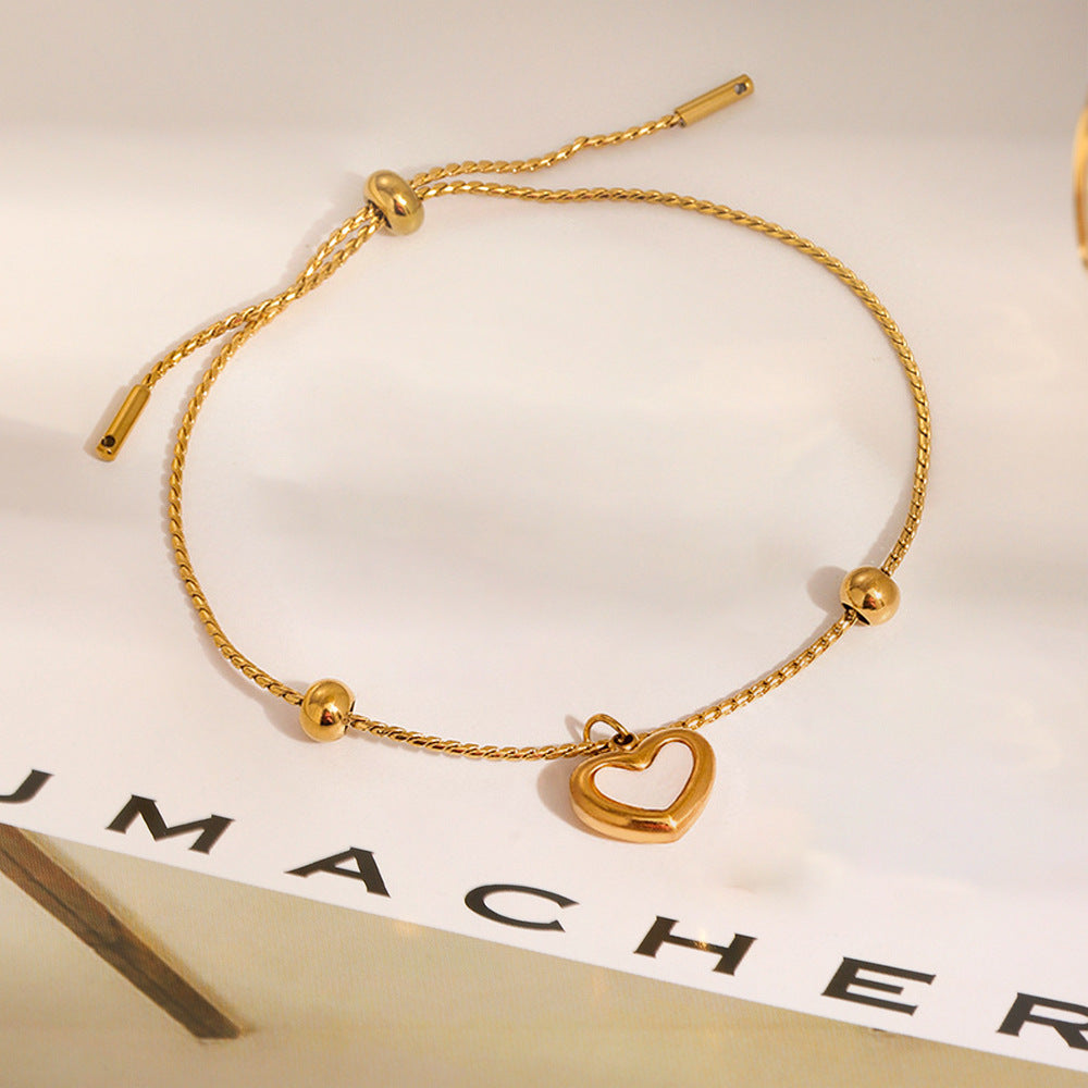 Bracelet en acier titanium avec coquillage en forme de cœur - NovaShop NovaShop E174 Bracelet Gold Bigbuy