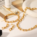 Set including necklace, horseshoe chain bracelet and earrings is made of high quality stainless steel