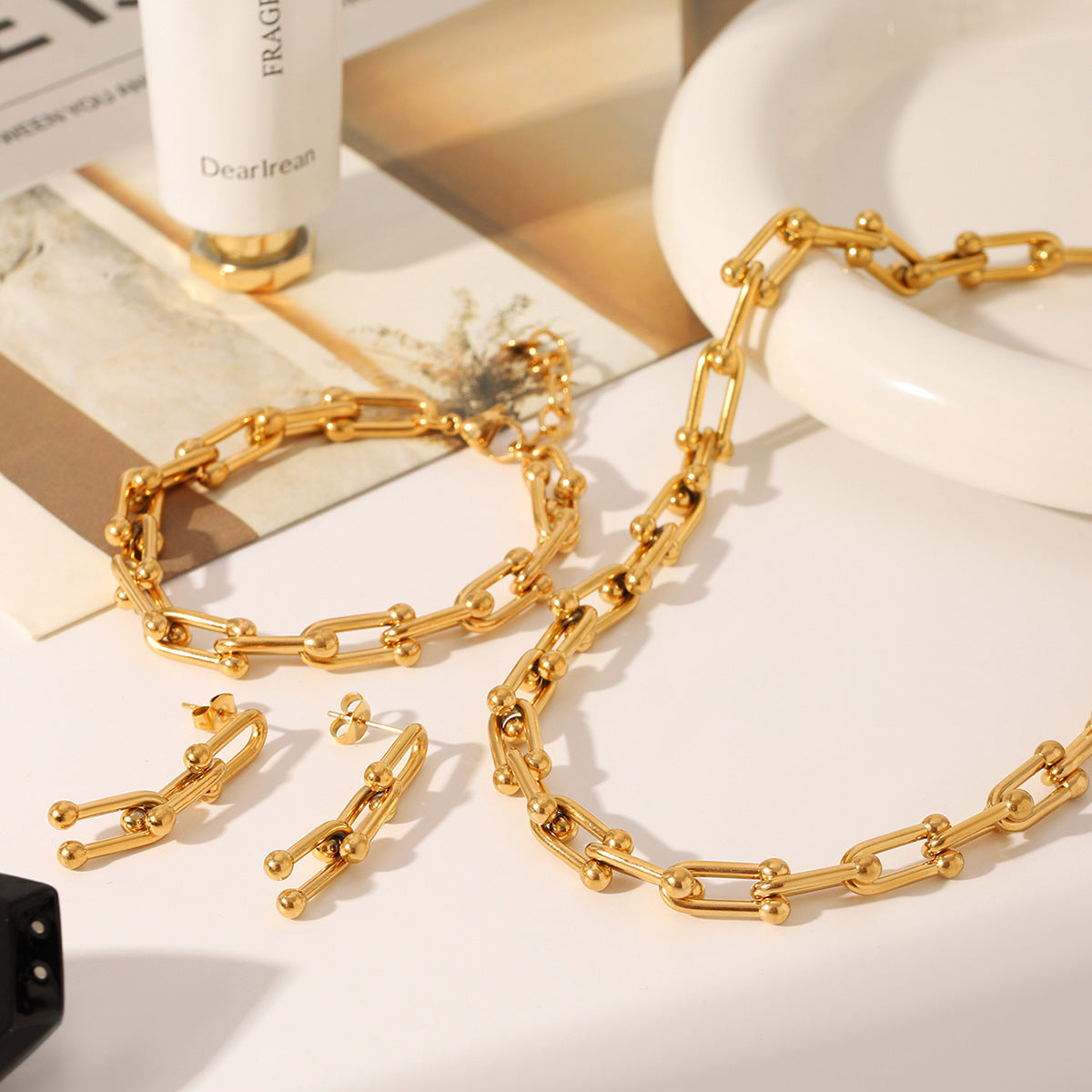 Set including necklace, horseshoe chain bracelet and earrings is made of high quality stainless steel
