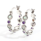 Earrings combine brilliance and delicacy, enhancing