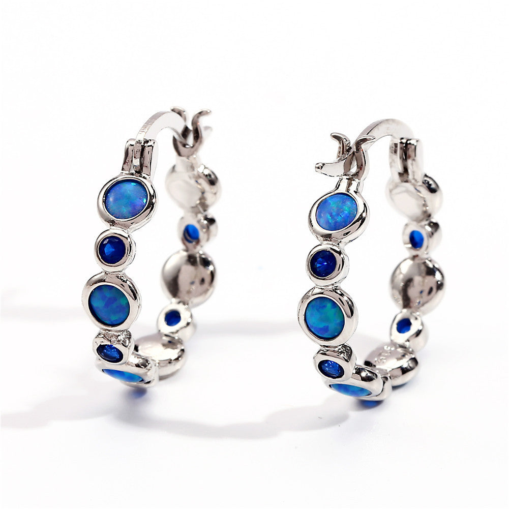 Earrings combine brilliance and delicacy, enhancing