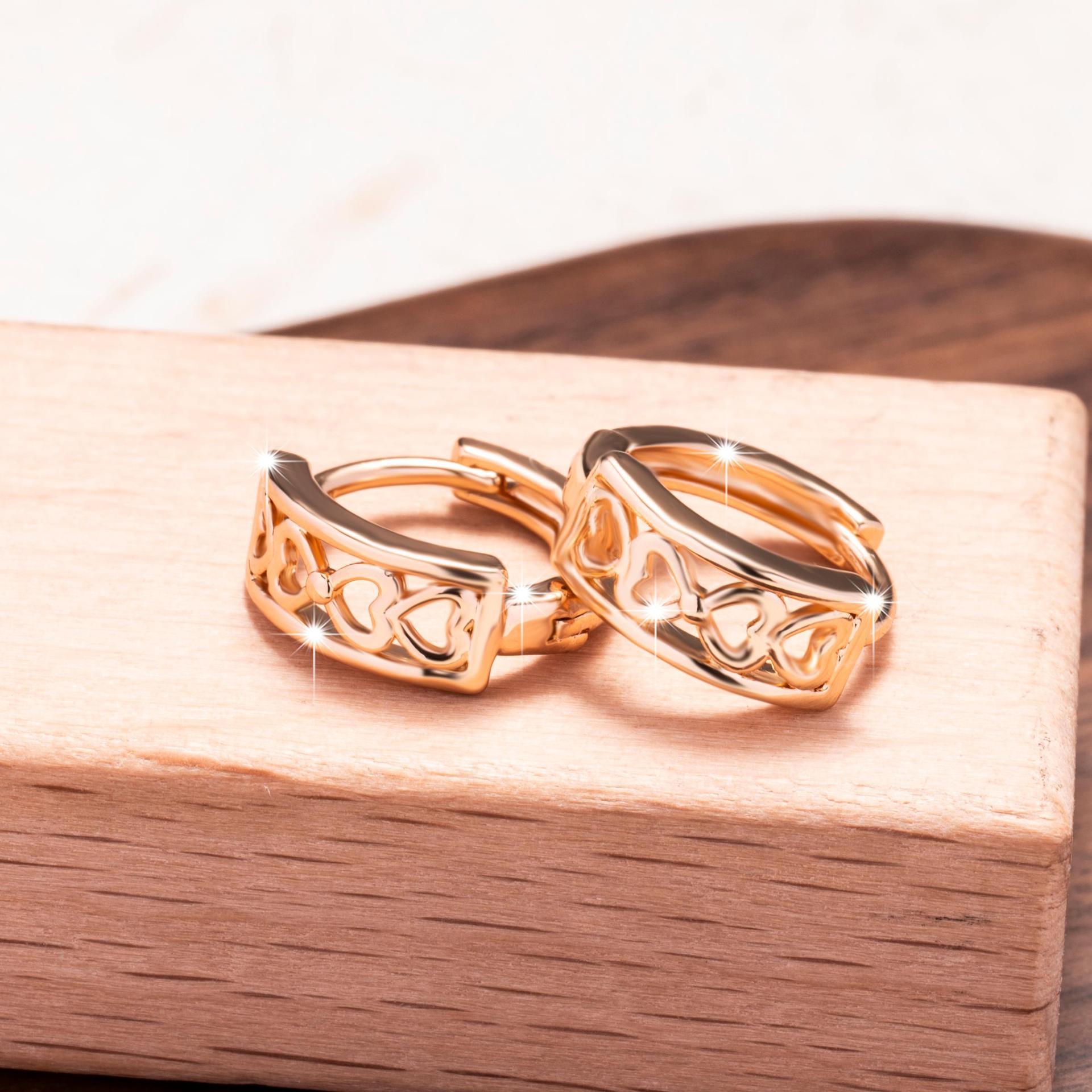Hollow heart clip-on earrings with a shiny finish