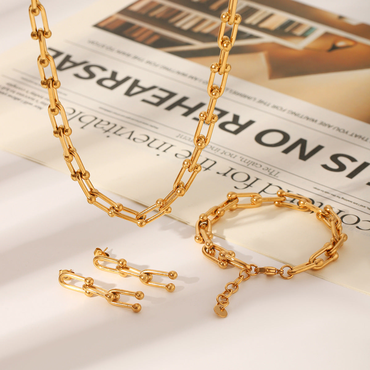 Set including necklace, horseshoe chain bracelet and earrings is made of high quality stainless steel
