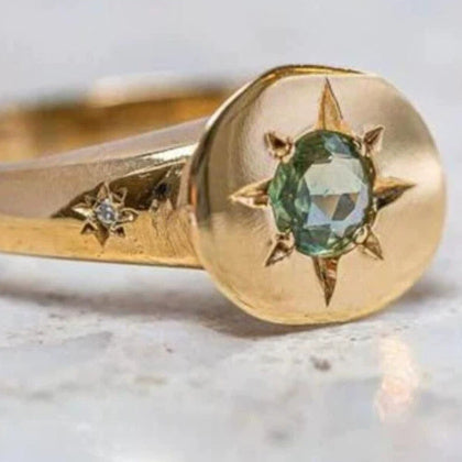 Simple temperament ring in golden oval zircon with asterism