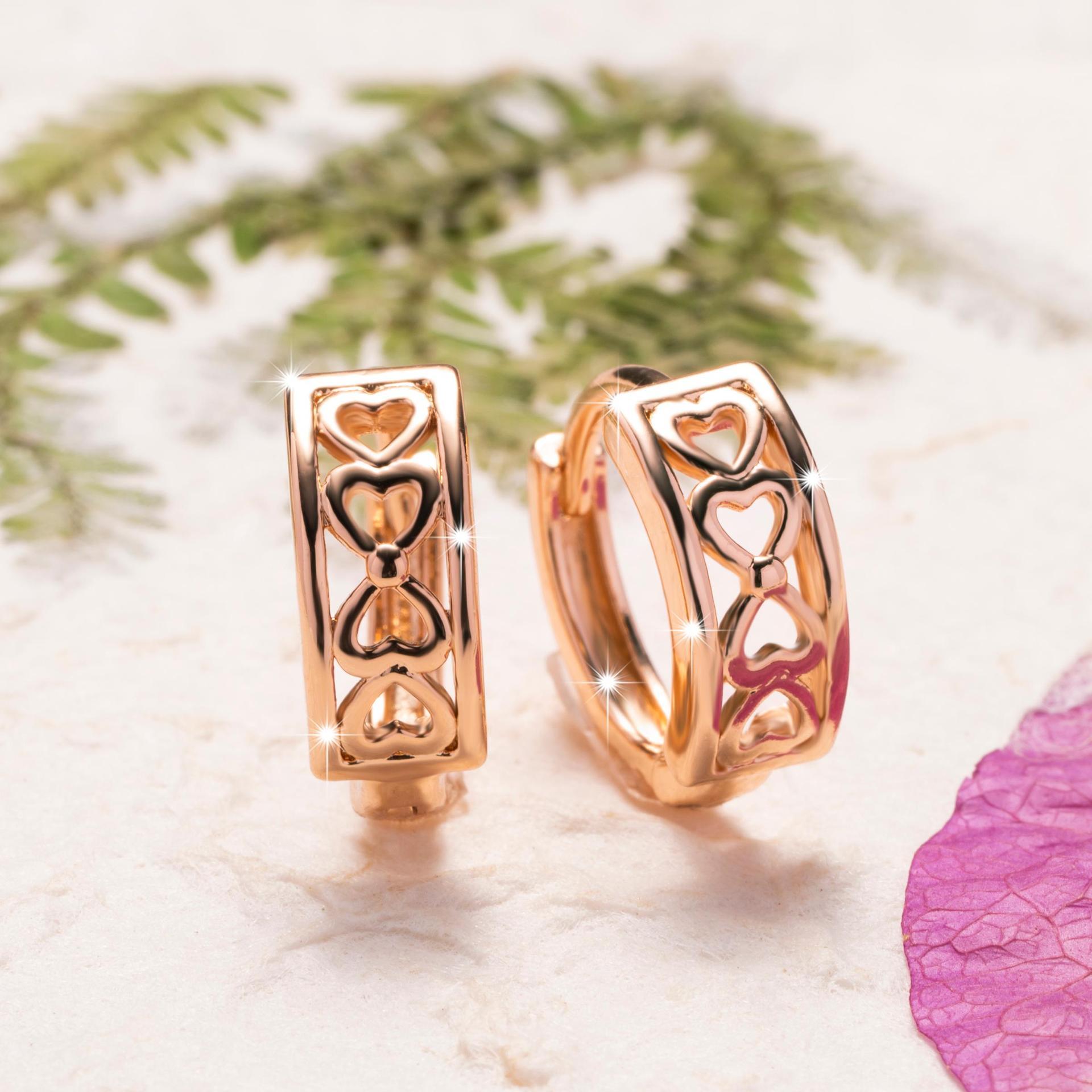 Hollow heart clip-on earrings with a shiny finish