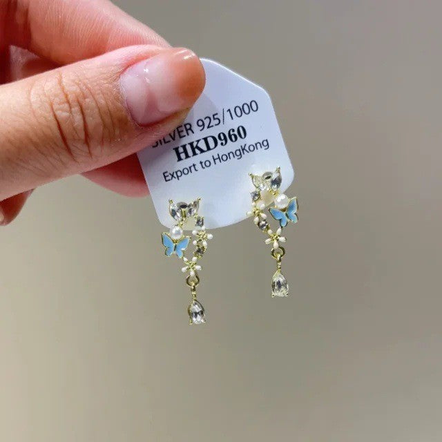 Sparkling star clip-on earrings with tassels