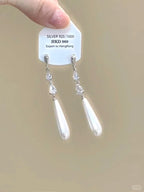 Sparkling star clip-on earrings with tassels