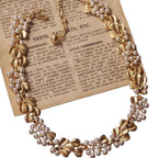 Vintage mid-antique necklace with ginkgo leaf and pearls, frosted brushed effect