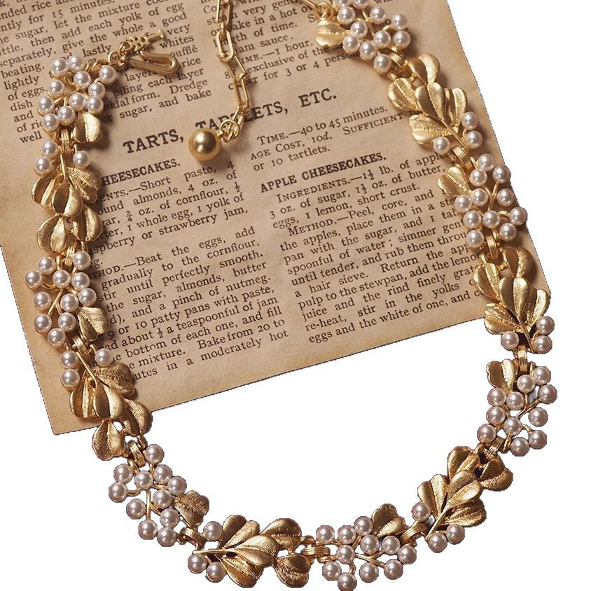 Vintage mid-antique necklace with ginkgo leaf and pearls, frosted brushed effect