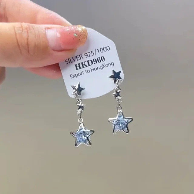 Sparkling star clip-on earrings with tassels