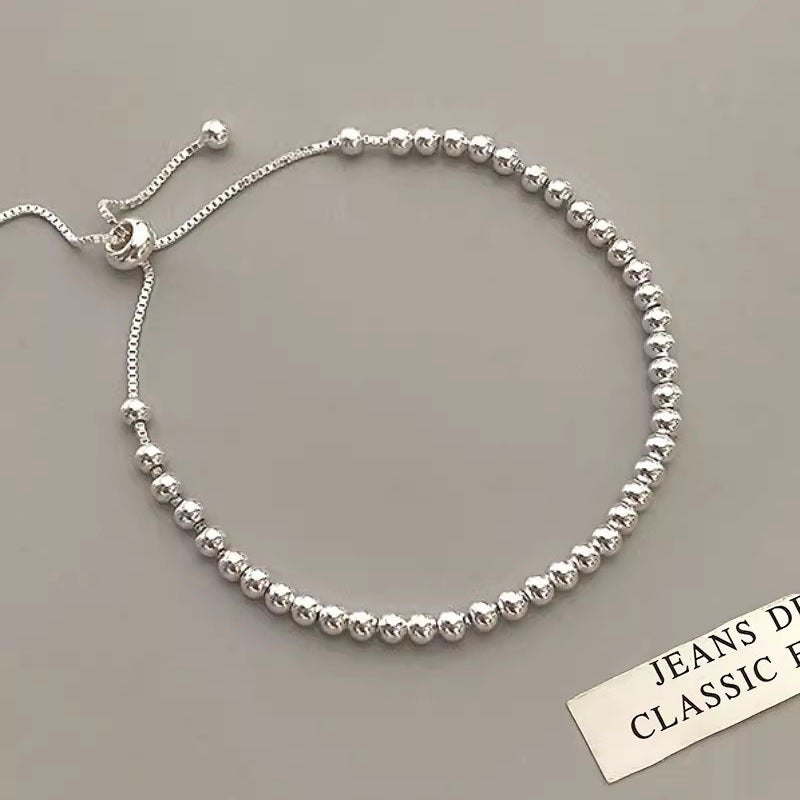 Simple and versatile silver round bead bracelet for women. New and simple
