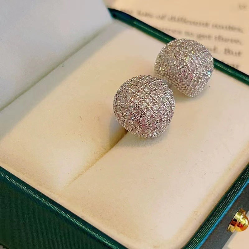 Light luxury clip-on earrings in the shape of small golden pearls adorned with diamonds