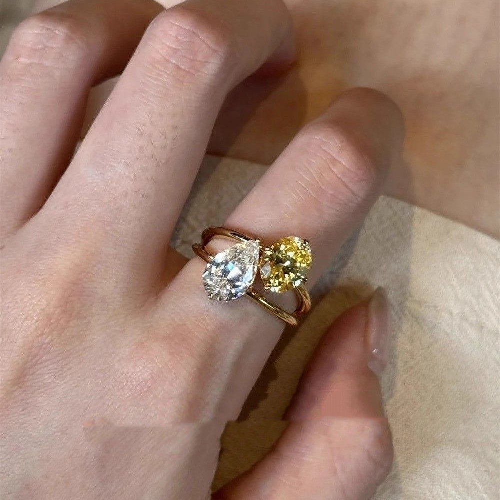 Lightweight open copper ring with contrasting teardrop zirconia