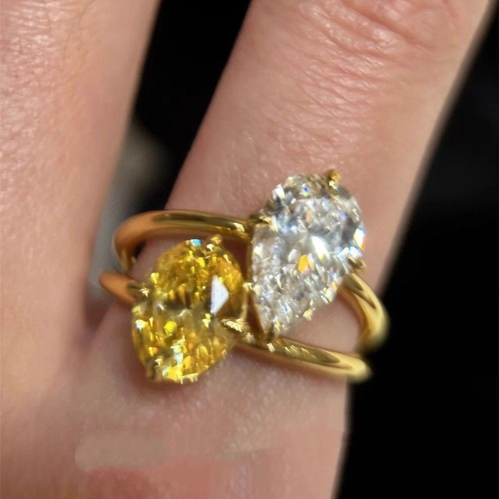 Lightweight open copper ring with contrasting teardrop zirconia