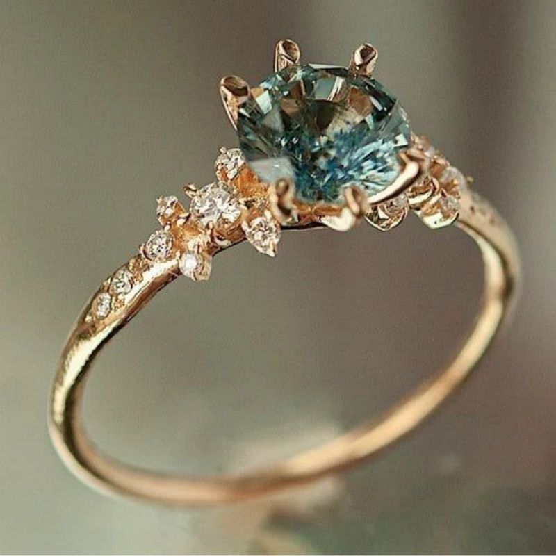 Creatively designed gold-plated ring, enhanced by a meticulous setting of zircons