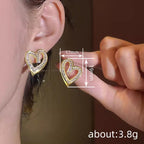 Elegant hollow heart shaped earrings with geometric design