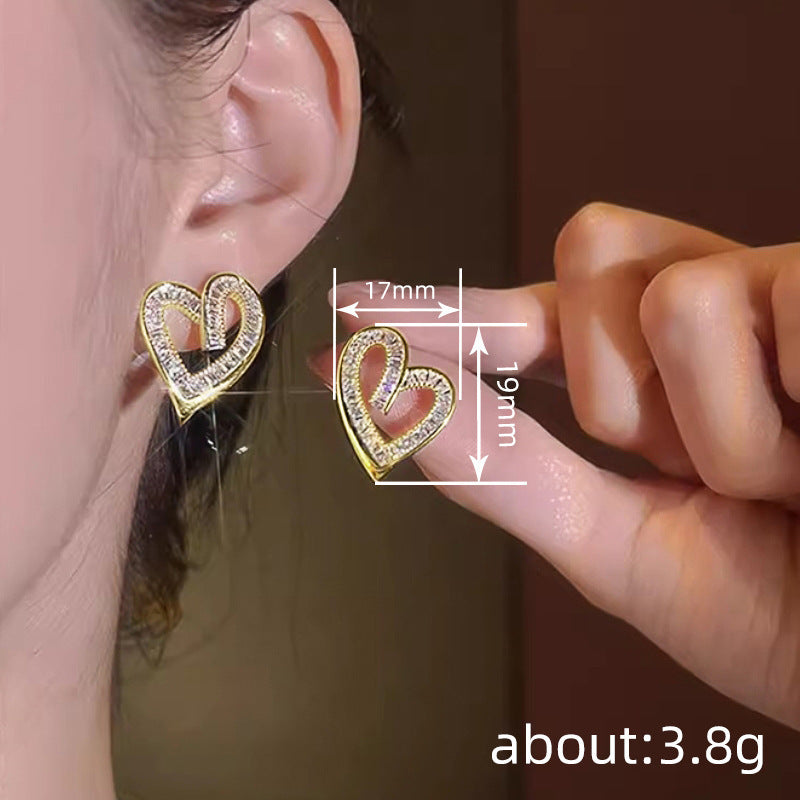 Elegant hollow heart shaped earrings with geometric design