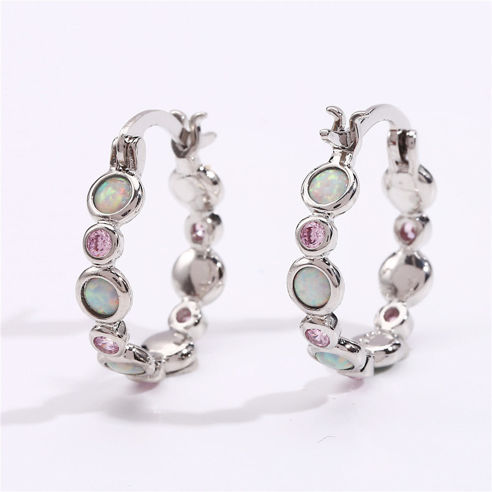 Earrings combine brilliance and delicacy, enhancing