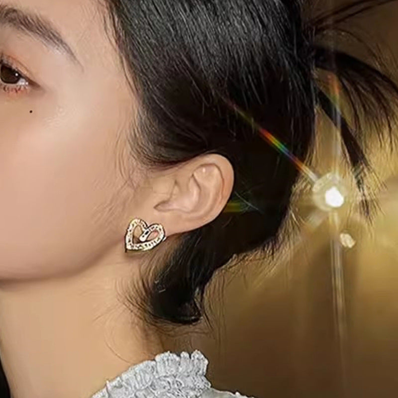Elegant hollow heart shaped earrings with geometric design