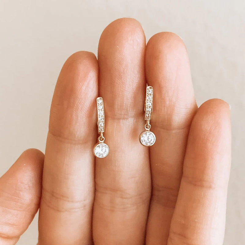 Round loop earrings fully paved with zircon