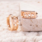 Hollow heart clip-on earrings with a shiny finish