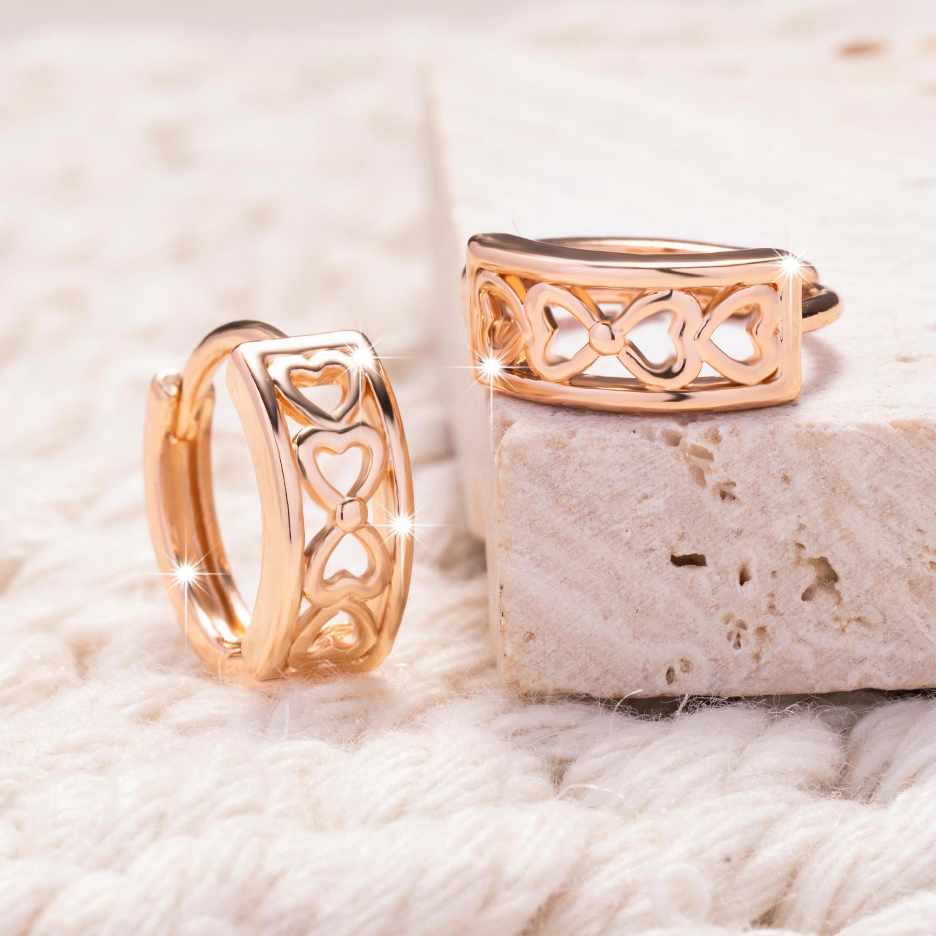 Hollow heart clip-on earrings with a shiny finish